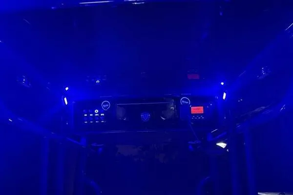 Slide: The Image of 1996 Formula 382 SR1 dashboard illuminated with blue LED lights at night. - 34