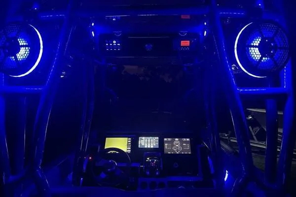 Slide: The Image of 1996 Formula 382 SR1 boat cockpit illuminated with blue LED lights at night. - 37