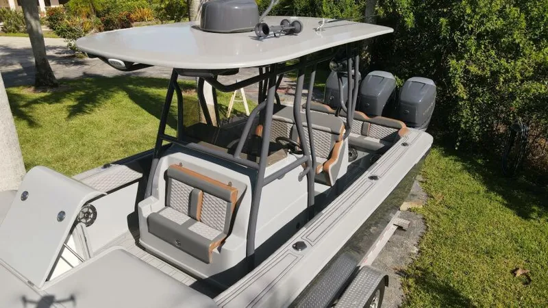 Slide: The Image of 1996 Formula 382 SR1 boat with dual engines, sleek design, and spacious seating. - 5