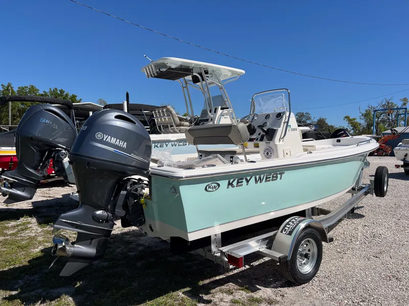Slide: The Image of 2025 Key West 1720 Center Console boat with Yamaha engines on a trailer. - 4
