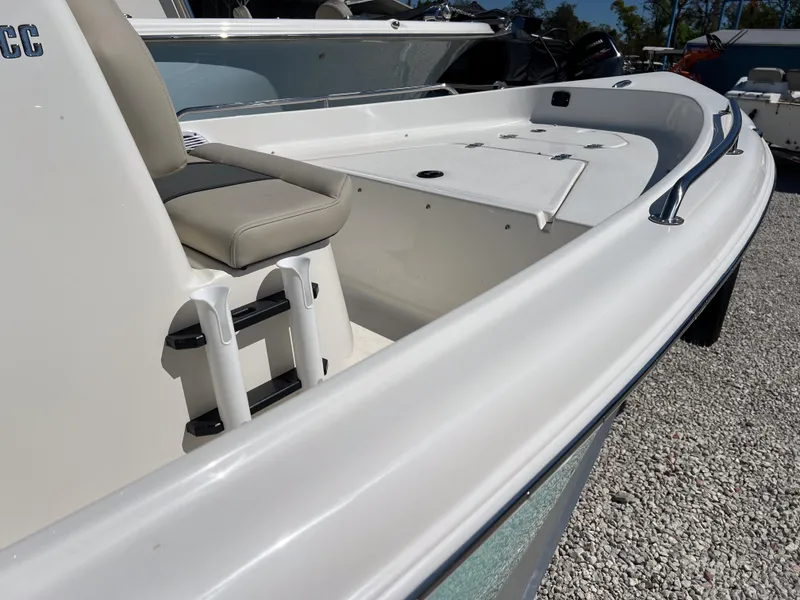 Slide: The Image of 2025 Key West 1720 Center Console boat with seating and storage, displayed outdoors. - 8