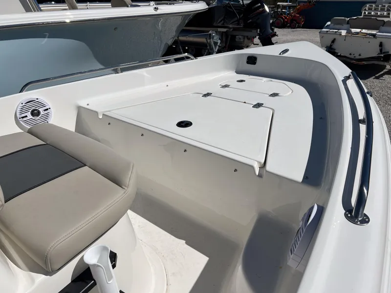 Slide: The Image of 2025 Key West 1720 Center Console boat interior with seating and storage compartments. - 9