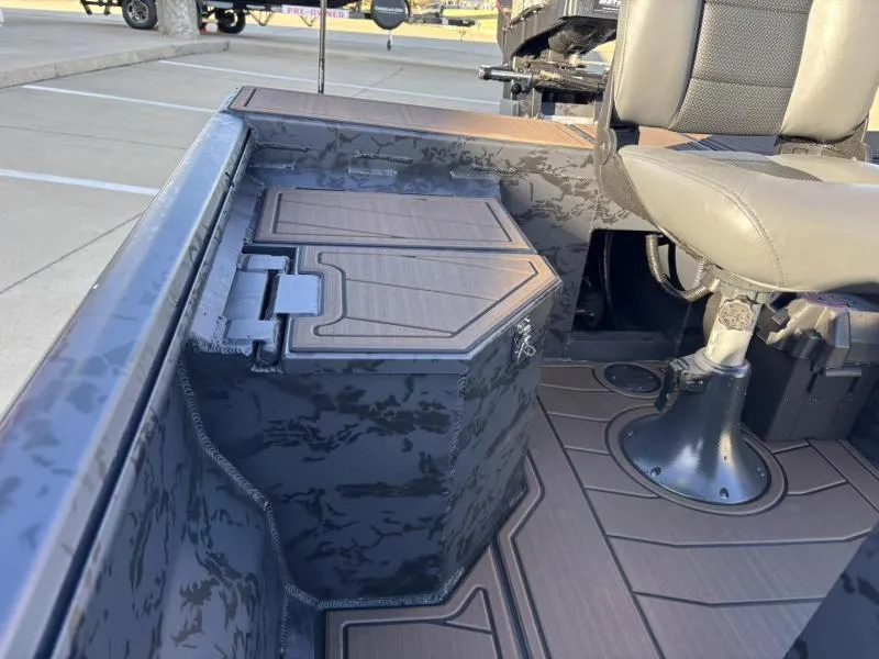 Slide: The Image of 2025 Gator Tail 18/60 Extreme Series boat interior with camo design and seating. - 11