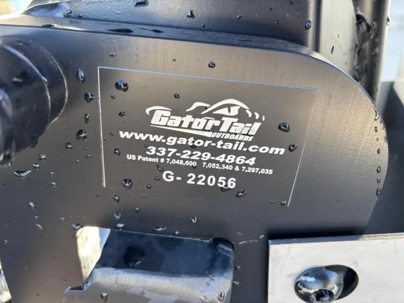 Slide: The Image of Gator Tail 18/60 Extreme Series 2025 outboard motor with contact details and patent numbers. - 15