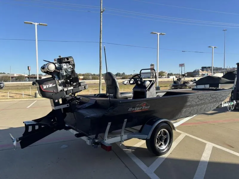 Slide: The Image of 2025 Gator Tail 18/60 Extreme Series boat on trailer in parking lot. - 5