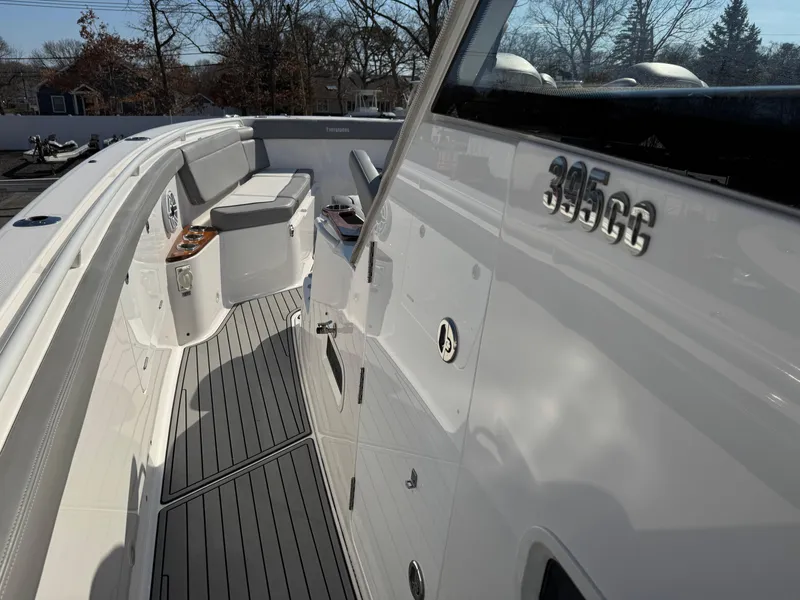 Slide: The Image of 2022 Everglades 395cc boat deck with seating and sleek design. - 18