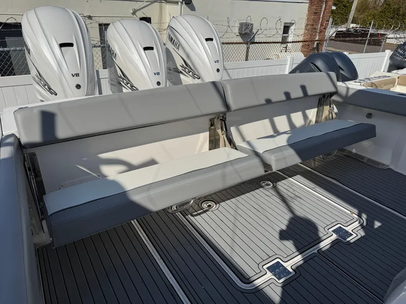 Slide: The Image of 2022 Everglades 395cc boat with triple V8 engines and spacious seating area. - 23