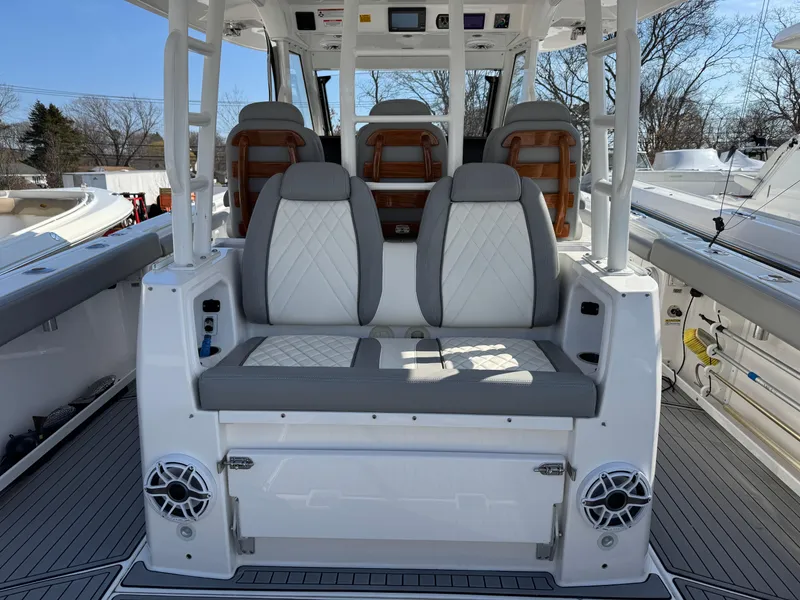 Slide: The Image of 2022 Everglades 395cc boat interior with cushioned seating and modern design. - 3