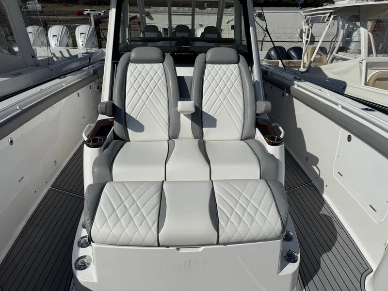 Slide: The Image of Luxury seating on 2022 Everglades 395cc boat with quilted white upholstery. - 6
