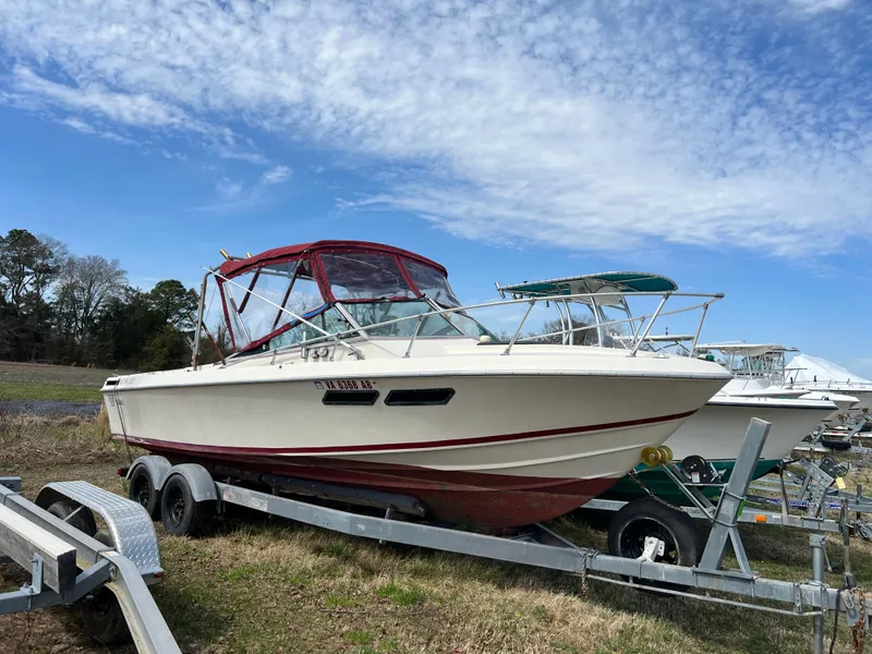 The Image of 1978 Wellcraft NOVA boat on trailer under blue sky. - 0