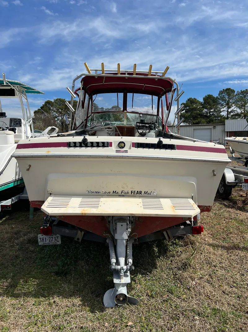 Slide: The Image of 1978 Wellcraft NOVA boat with humorous text, parked on grass under a blue sky. - 3