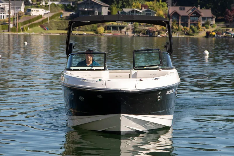 Slide: The Image of 2020 Sea Ray SLX 250 boat on a calm lake with scenic background. - 16