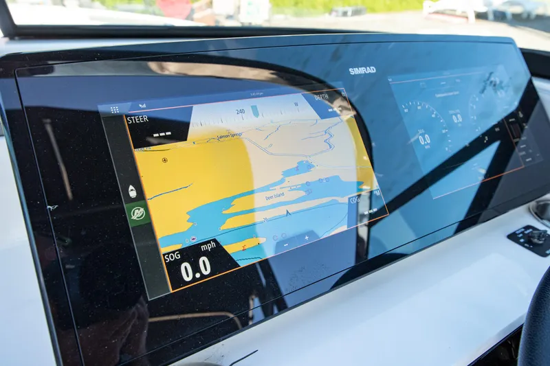 Slide: The Image of Dashboard of 2020 Sea Ray SLX 250 boat with navigation display. - 30