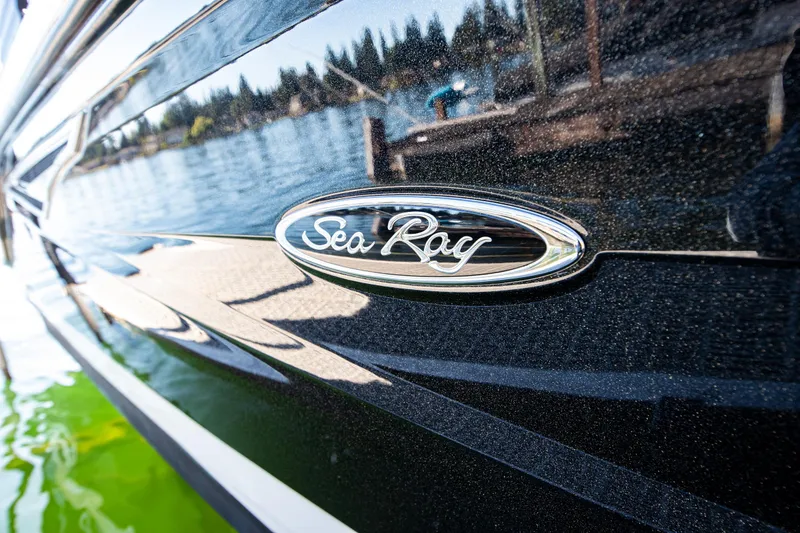 Slide: The Image of Close-up of 2020 Sea Ray SLX 250 boat logo on sleek black exterior. - 42