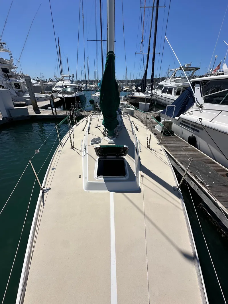 Slide: The Image of 1996 J Boats J/120 sailboat docked at marina, view of deck and mast. - 19