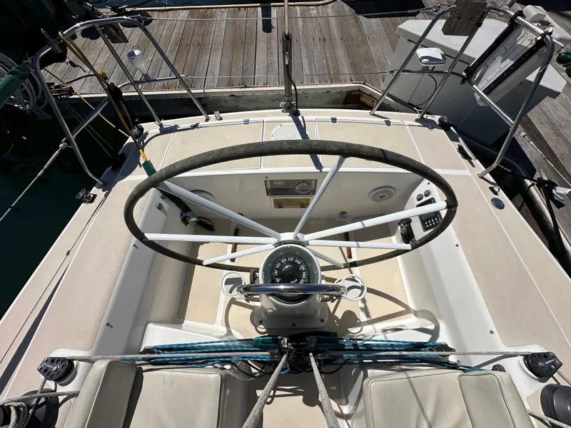Slide: The Image of Cockpit of 1996 J Boats J/120 sailboat with steering wheel and navigation instruments. - 26