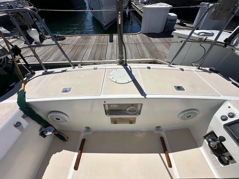 Slide: The Image of 1996 J Boats J/120 cockpit with clean deck and marina view. - 27