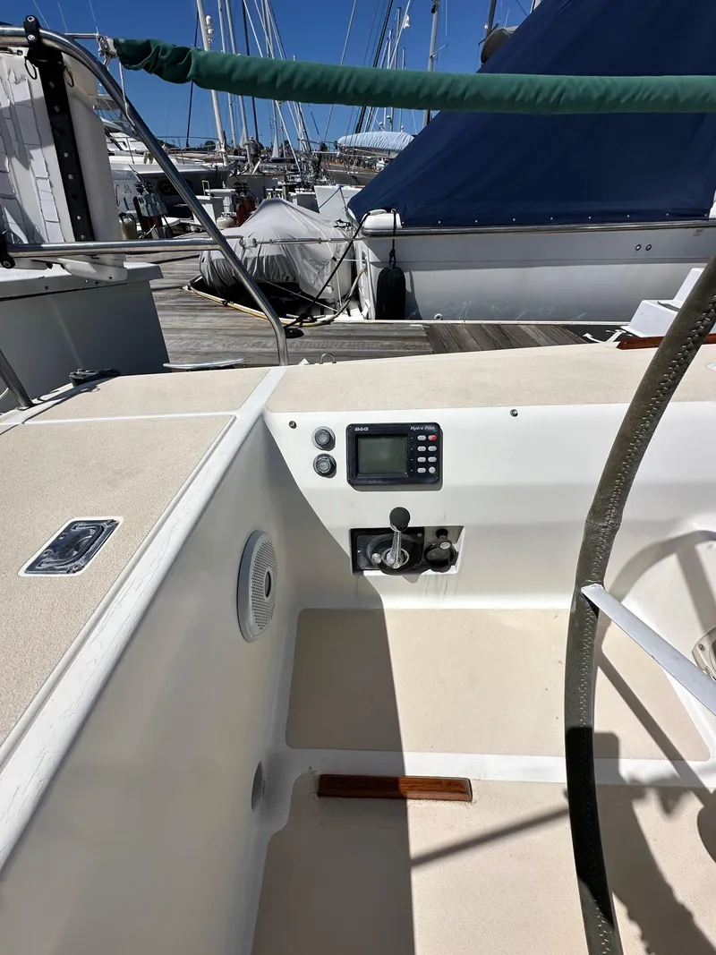 Slide: The Image of 1996 J Boats J/120 cockpit with navigation equipment and steering wheel. - 28