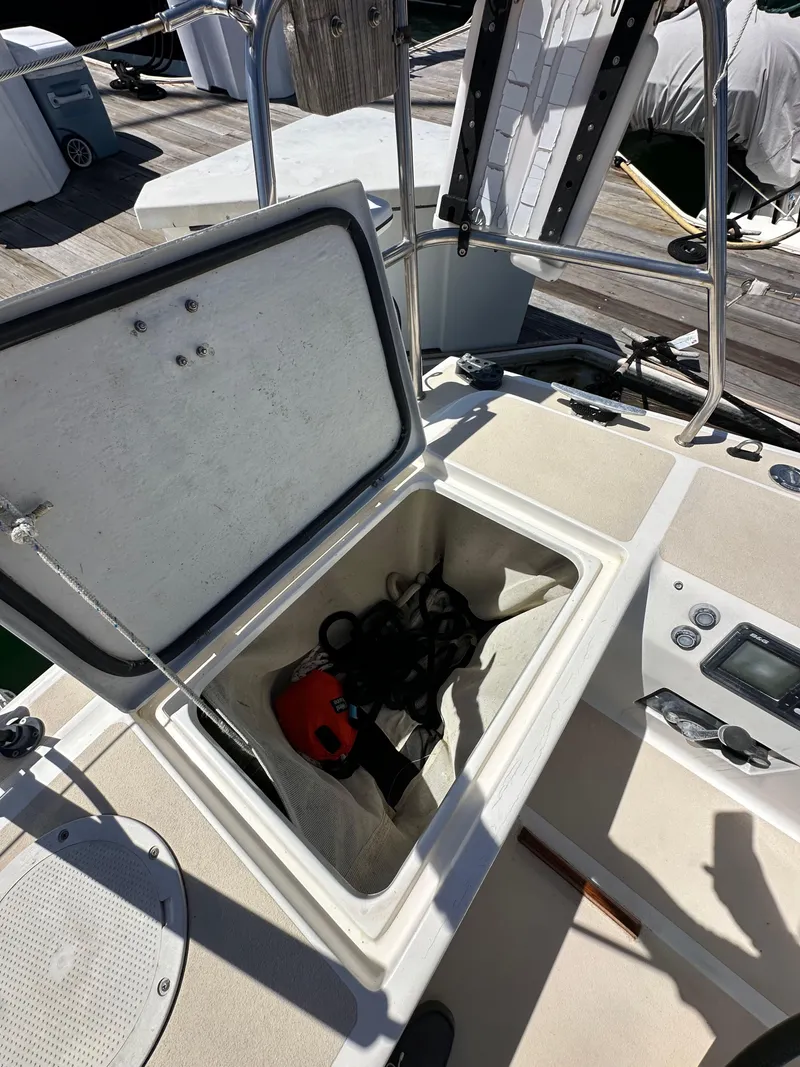 Slide: The Image of Open storage compartment on a 1996 J Boats J/120 sailboat deck. - 29