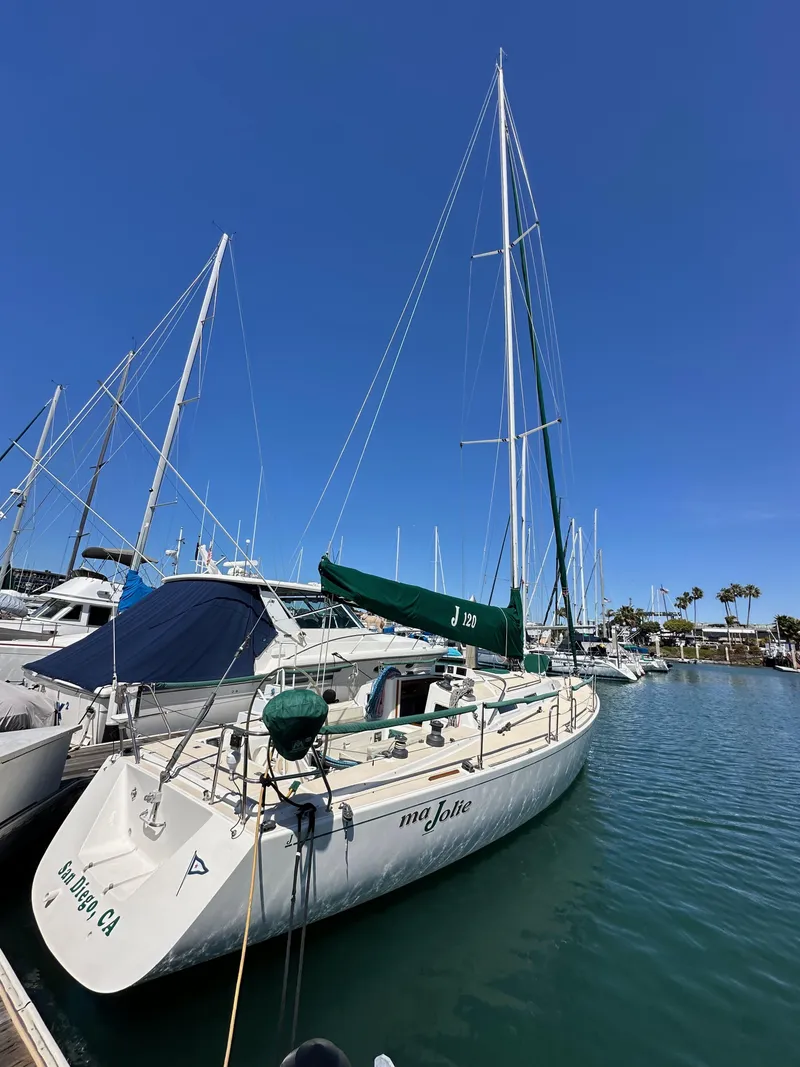 Slide: The Image of 1996 J Boats J/120 sailboat docked in marina under clear blue sky. - 3