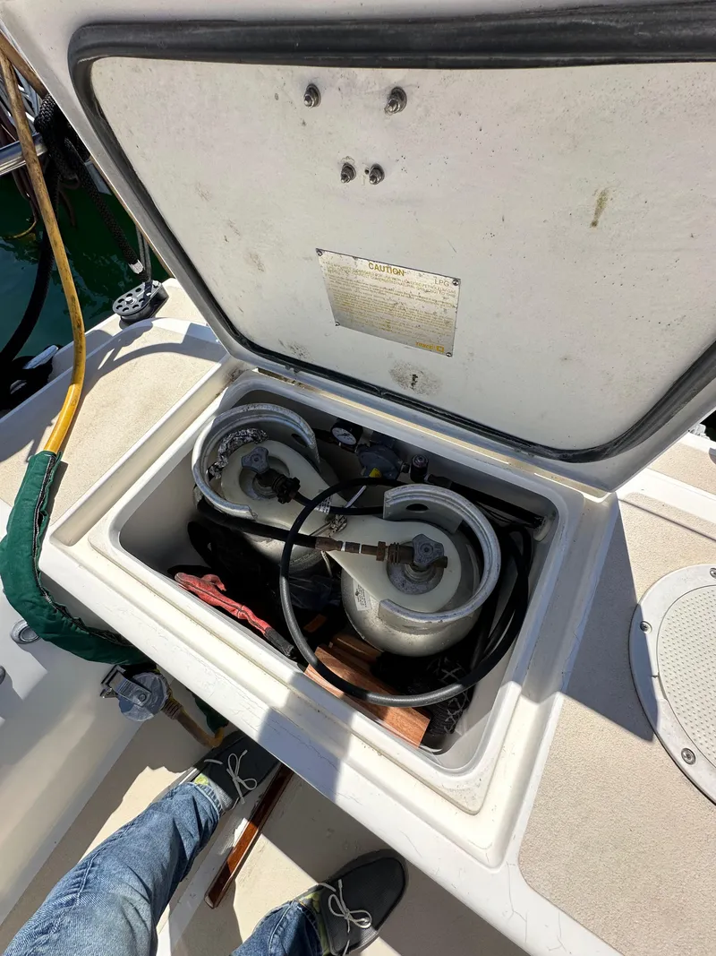 Slide: The Image of Open storage compartment on 1996 J Boats J/120 sailboat deck. - 30