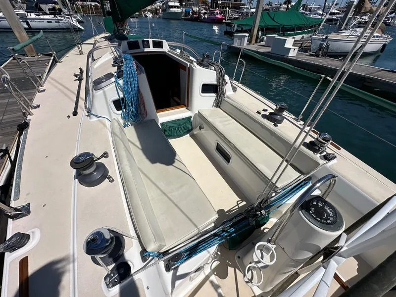 Slide: The Image of 1996 J Boats J/120 sailboat cockpit with winches and seating, docked at marina. - 31