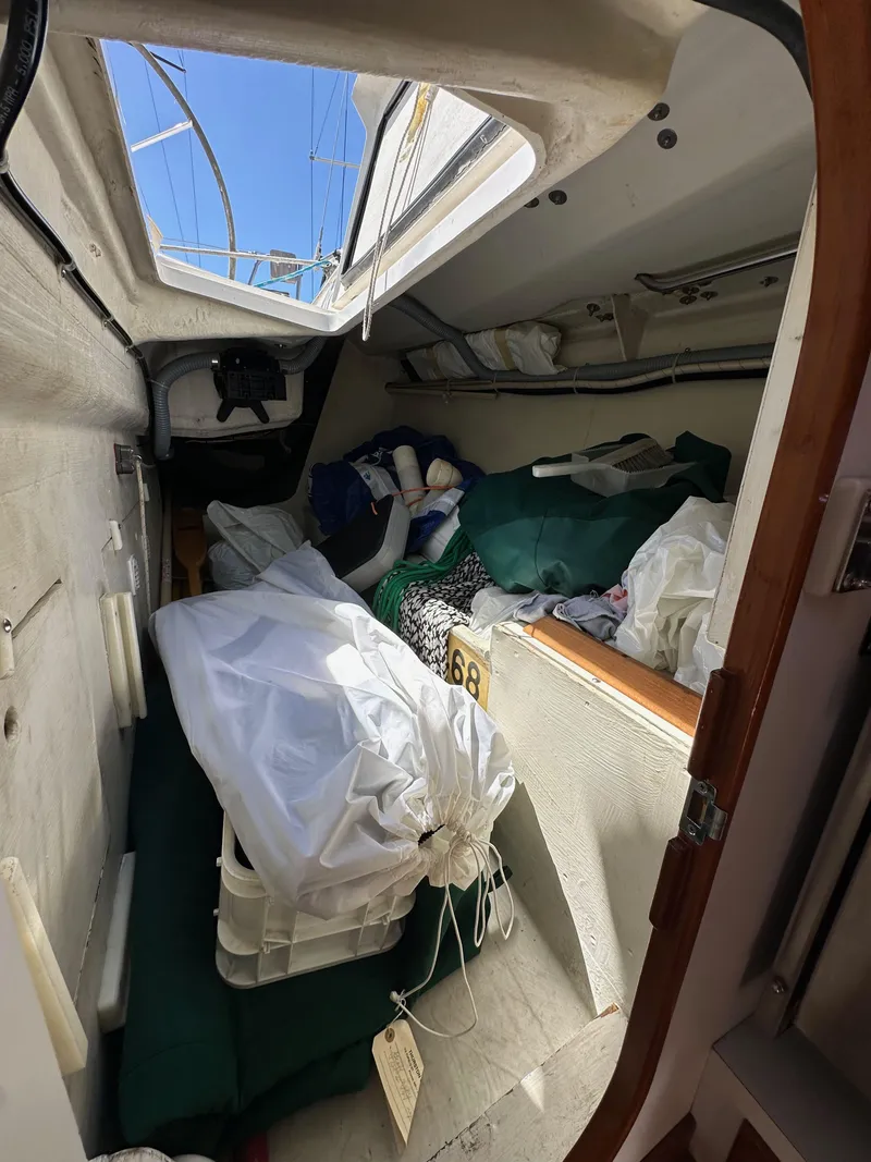 Slide: The Image of Interior of a 1996 J Boats J/120 sailboat, showing storage and equipment. - 34