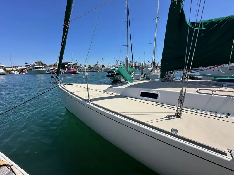 Slide: The Image of 1996 J Boats J/120 sailboat docked in a sunny marina. - 9