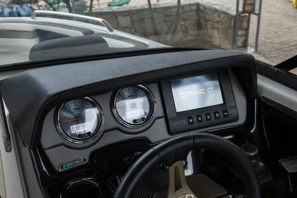 Slide: The Image of Dashboard of 2016 Yamaha Boats 242 Limited S E-Series with digital display and gauges. - 18
