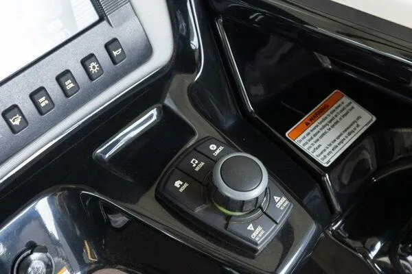 Slide: The Image of Control panel of 2016 Yamaha Boats 242 Limited S E-Series, featuring navigation and function buttons. - 20