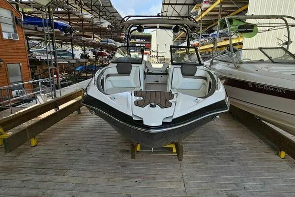 Slide: The Image of 2016 Yamaha Boats 242 Limited S E-Series on dock, front view, in storage facility. - 3