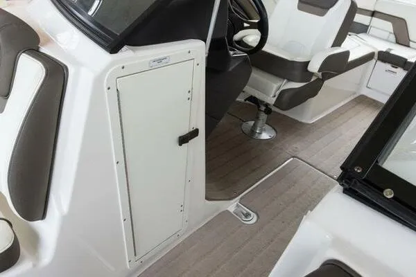 Slide: The Image of 2016 Yamaha Boats 242 Limited S E-Series interior with seating and storage compartment. - 30