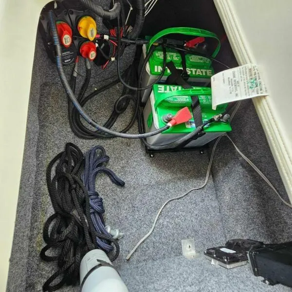 Slide: The Image of Battery compartment of 2016 Yamaha Boats 242 Limited S E-Series with cables and ropes. - 39