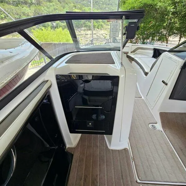 Slide: The Image of 2016 Yamaha Boats 242 Limited S E-Series interior with seating and storage. - 43