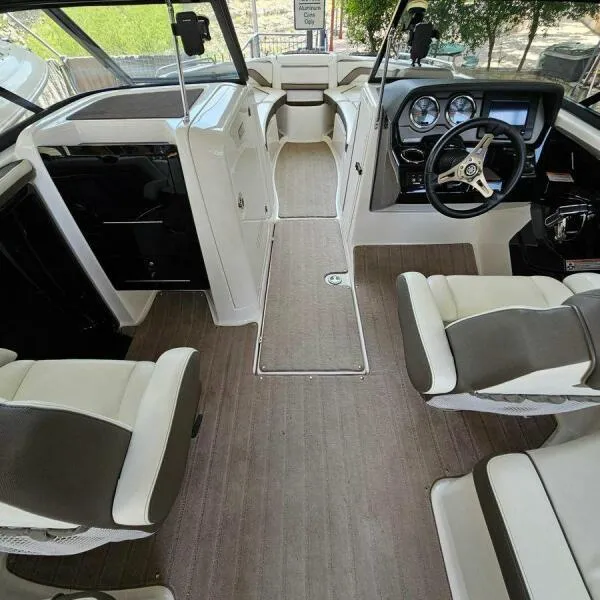 Slide: The Image of Interior of 2016 Yamaha Boats 242 Limited S E-Series, featuring sleek seating and modern dashboard. - 45