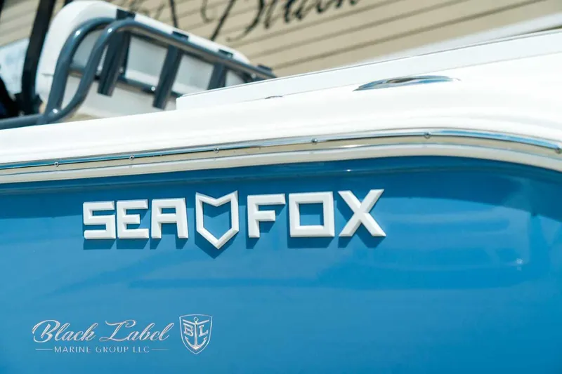 Slide: The Image of 2025 Sea Fox 248 Commander boat with blue hull and logo. - 1