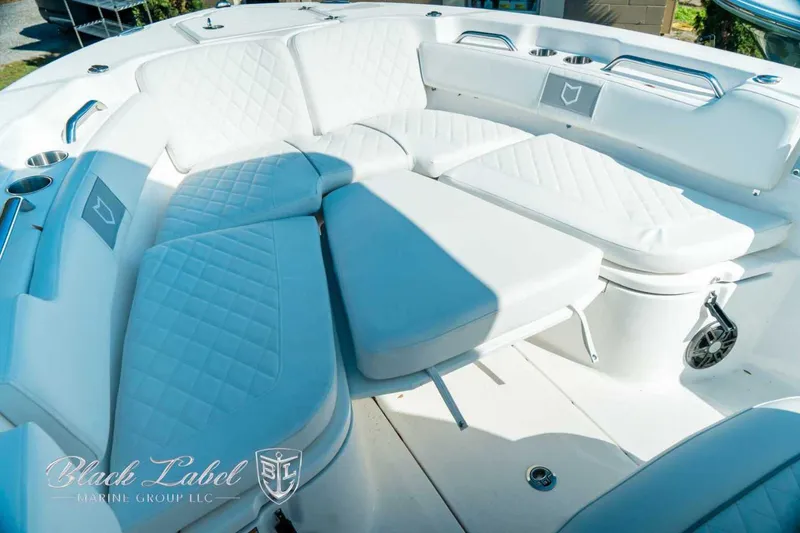 Slide: The Image of Luxurious seating on 2025 Sea Fox 248 Commander boat, featuring white quilted upholstery. - 12