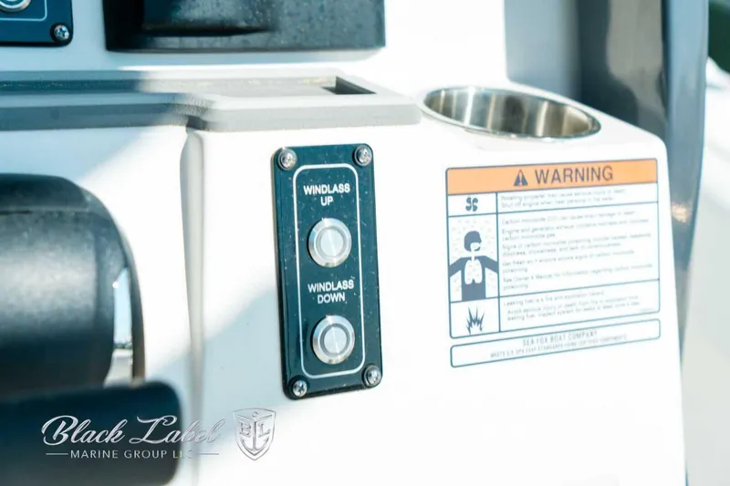 Slide: The Image of Control panel of 2025 Sea Fox 248 Commander with windlass buttons and warning label. - 19