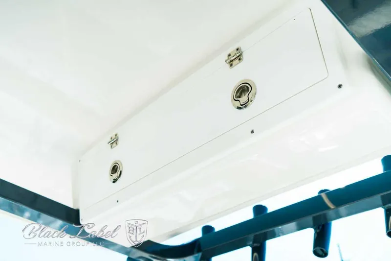 Slide: The Image of 2025 Sea Fox 248 Commander storage compartment with secure latches, by Black Label Marine Group. - 22