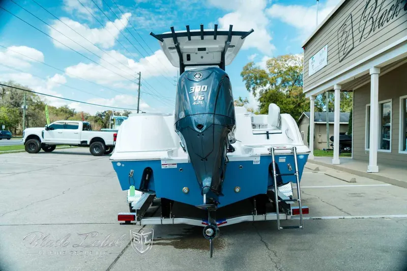 Slide: The Image of 2025 Sea Fox 248 Commander boat with Yamaha 300 V6 engine, parked outdoors. - 5