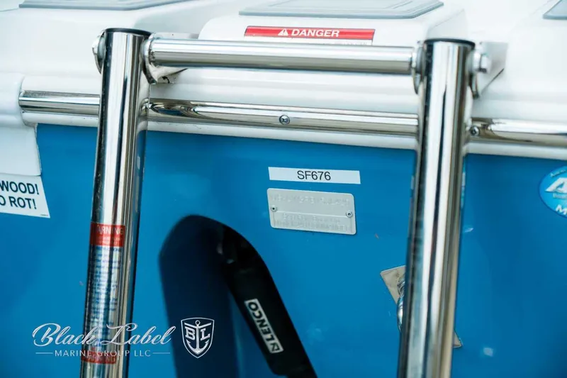 Slide: The Image of 2025 Sea Fox 248 Commander boat detail with safety warning and branding. - 6