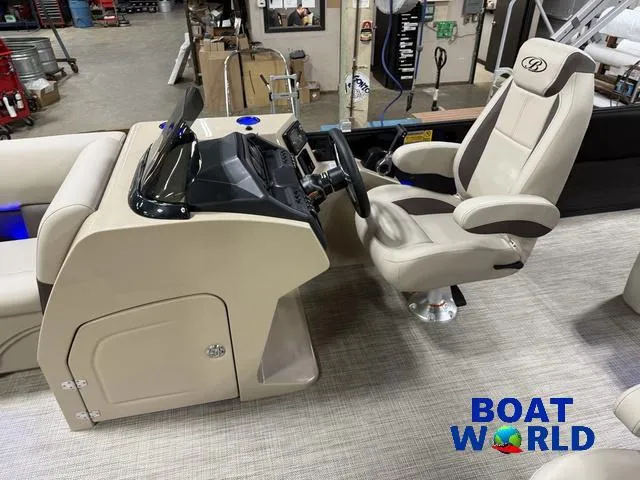 Slide: The Image of 2025 Bentley Pontoons Legacy 223 Swingback Tritoon interior with captain's chair and control panel. - 11