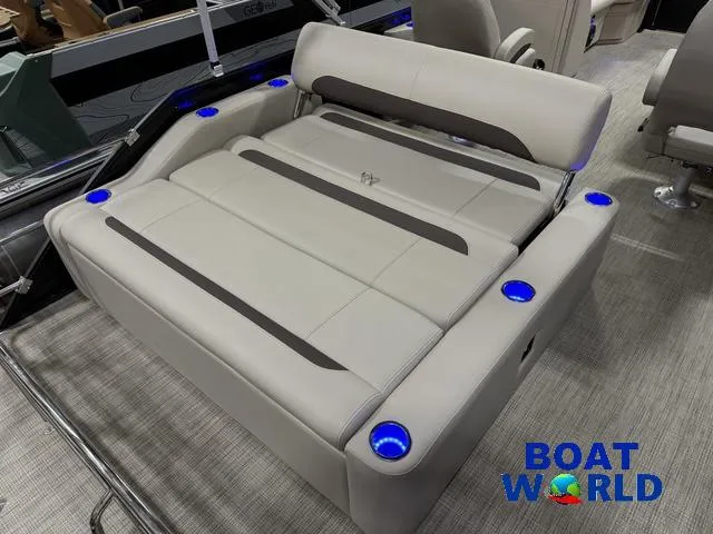 Slide: The Image of 2025 Bentley Pontoons Legacy 223 Swingback Tritoon interior with luxurious seating and cup holders. - 20