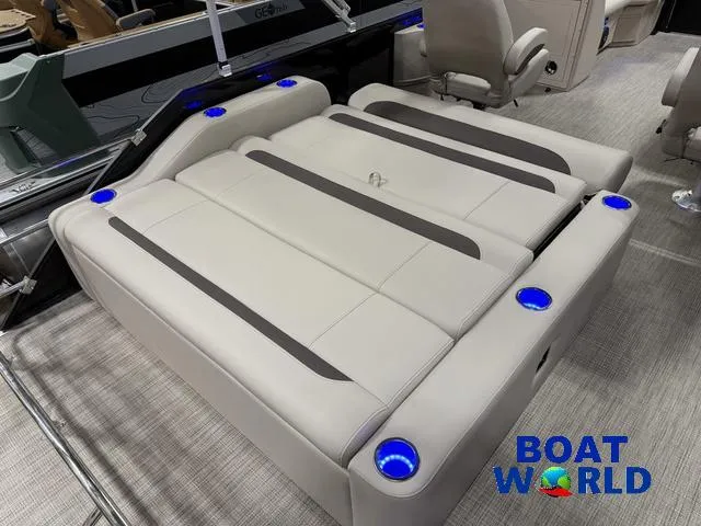 Slide: The Image of 2025 Bentley Pontoons Legacy 223 Swingback Tritoon interior with cushioned seating and cup holders. - 21
