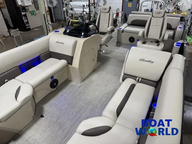 Slide: The Image of 2025 Bentley Pontoons Legacy 223 Swingback Tritoon interior with luxurious seating and modern design. - 36