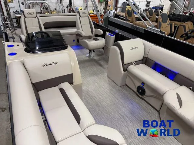 Slide: The Image of 2025 Bentley Pontoons Legacy 223 Swingback Tritoon interior with luxurious seating and ambient lighting. - 37