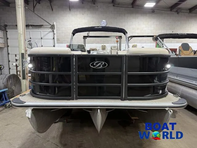 Slide: The Image of 2025 Bentley Pontoons Legacy 223 Swingback Tritoon in showroom, front view. - 38