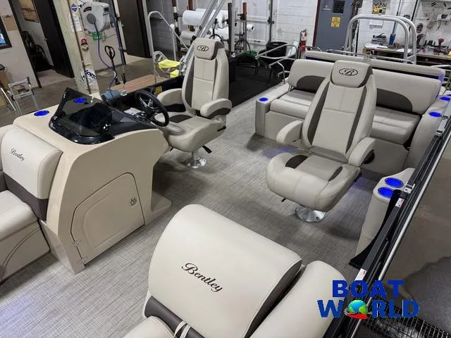 Slide: The Image of 2025 Bentley Pontoons Legacy 223 Tritoon interior with luxurious seating and modern helm. - 4