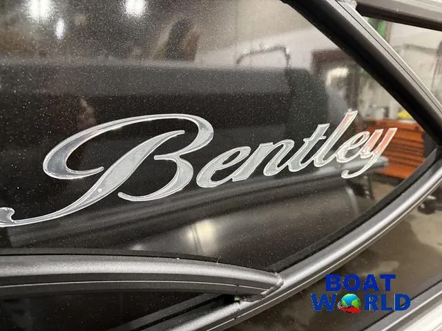 Slide: The Image of 2025 Bentley Pontoons Legacy 223 Swingback Tritoon logo close-up at Boat World showroom. - 41