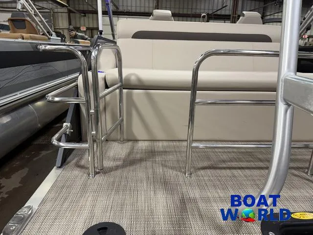 Slide: The Image of 2025 Bentley Pontoons Legacy 223 Tritoon interior with swingback seating and metal railings. - 48